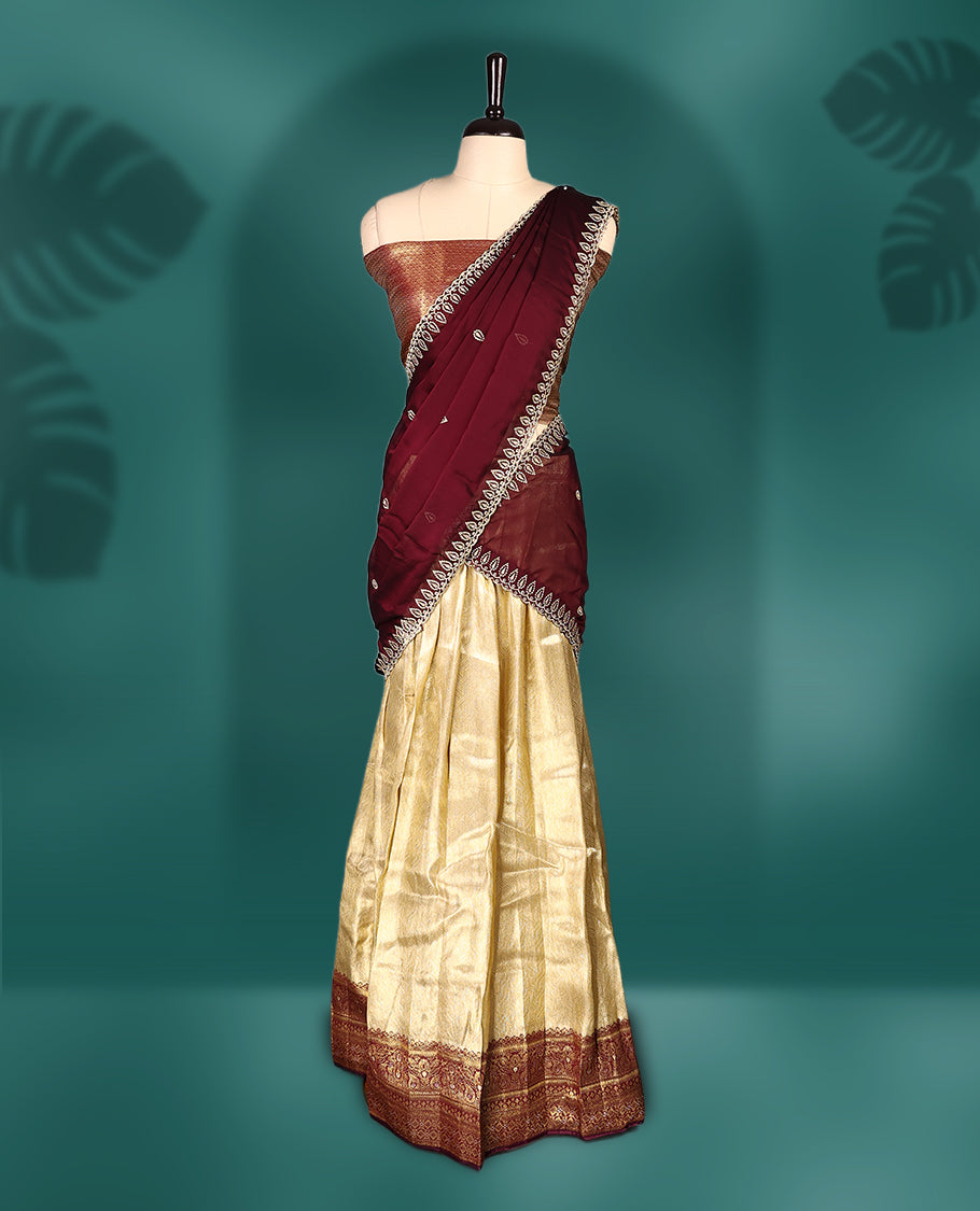 Graceful semi stitched Dhavani set featuring a deep maroon embroidered dupatta, golden zari lehenga, and matching blouse & Perfect for weddings, festivals, and traditional celebrations.