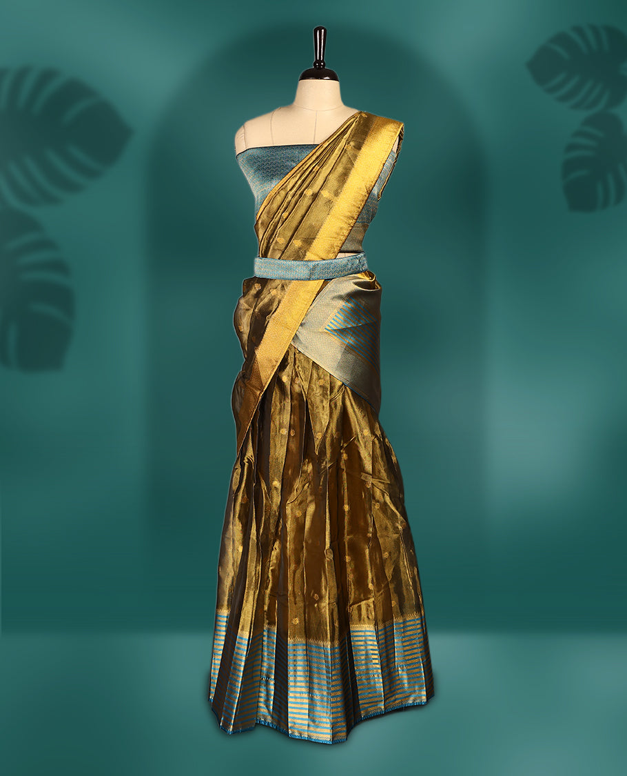 Graceful semi stitched dhavani set in golden mustard and dark aqua blue, crafted in silk with rich zari work & Perfect for festive occasions, weddings, and traditional events, Customizable for a perfect fit.