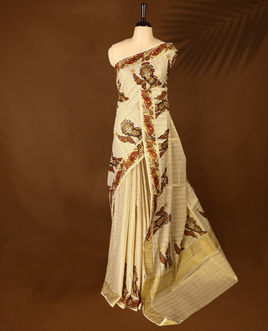 Light Gold colour Tissue Kerala saree featuring Kerala traditioal Prints on checked body and a beautifully woven Gold Kasavu border, paired with a matching blouse perfect for festive occasions.
