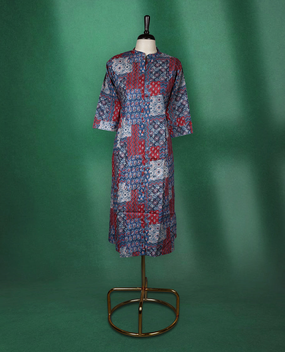 Multicolour colour kurti adorned with vibrant patchwork style prints in shades of red, blue, and white, featuring a mandarin collar, front placket, and three quarter sleeves a bold and comfortable choice for everyday fashion.