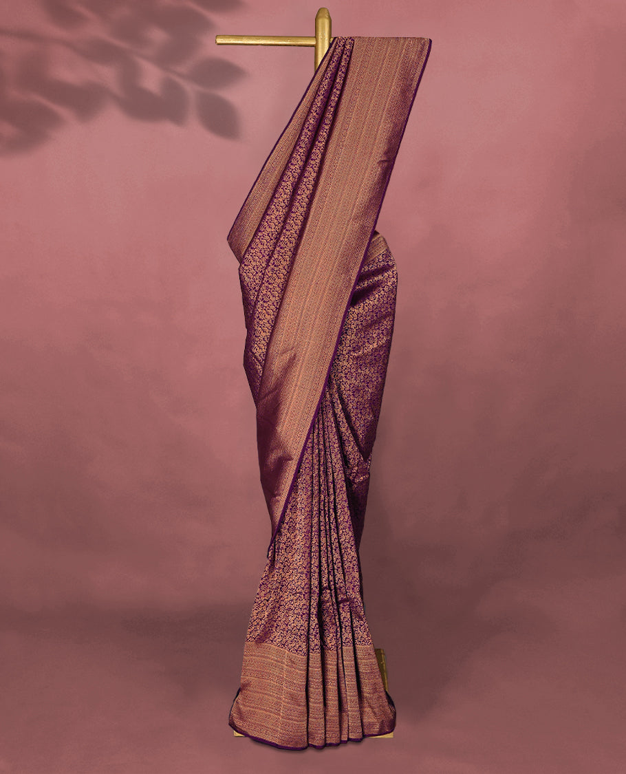 Royal Purple colour Kancheepuram saree featuring an antique zari brocade body, complemented by a traditional border and a matching blouse.