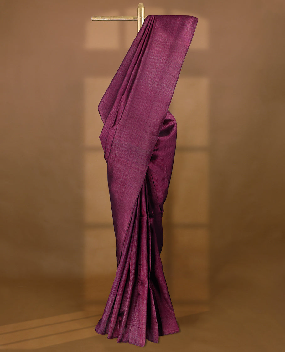 Cranberry coloured Manthrakodi saree featuring a multicoloured zari jacquard body, complemented by a self coloured turning Banarasi border and a matching self coloured blouse.