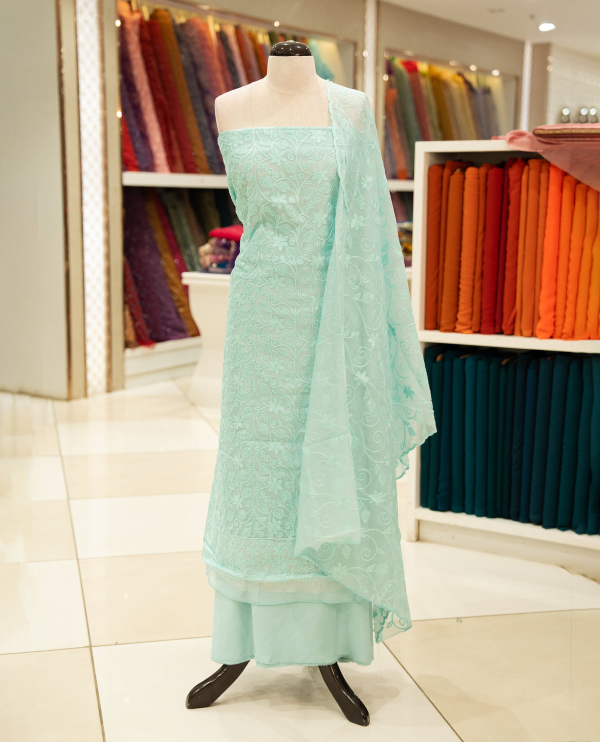 Blue colour Mul chanderi Salwar material featuring Floral Paisley Inspired Chikankari work on body, associate with same material dupatta with Scallop border & santoon bottom, comes with lining.
