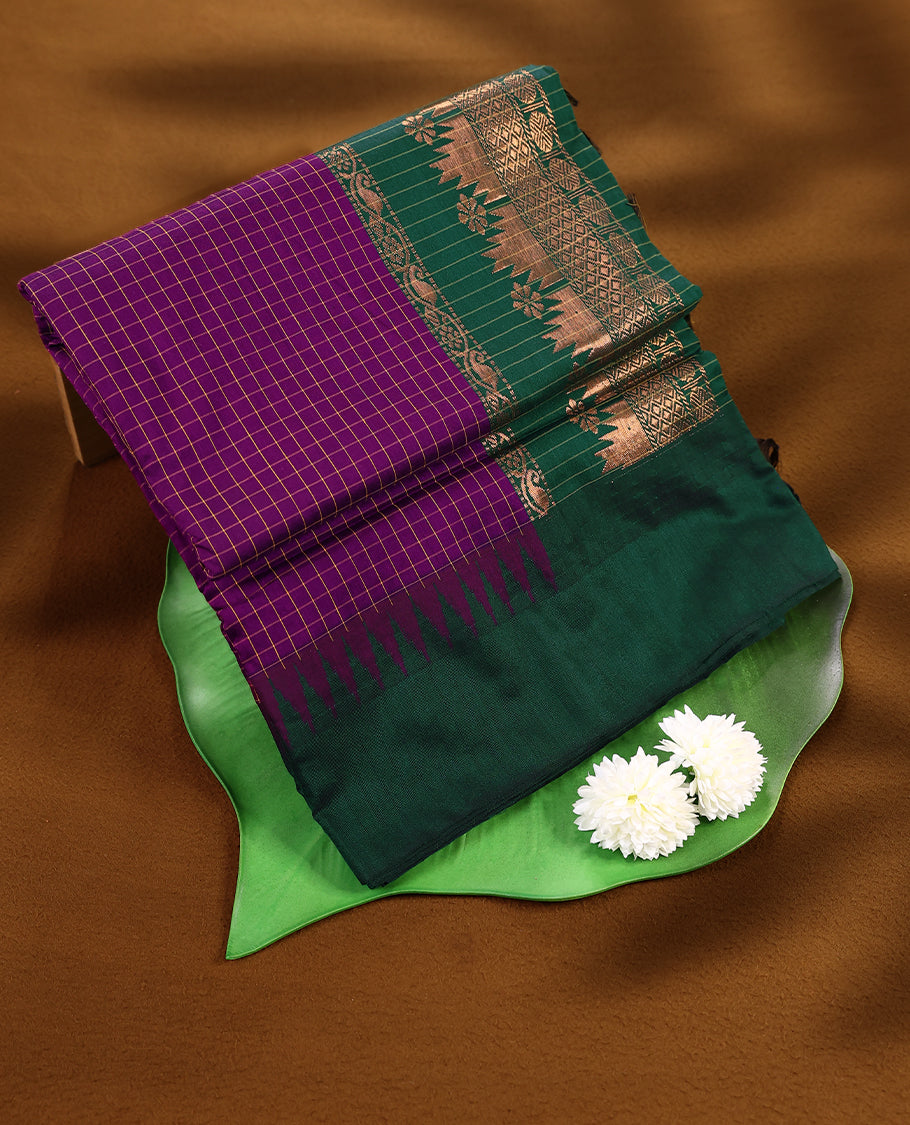 Purple colour mixed Kalyani cotton saree featuring Yellow zari checks throughout the body, paired with a Bottle Green colour traditional border and pallu, with matching blouse