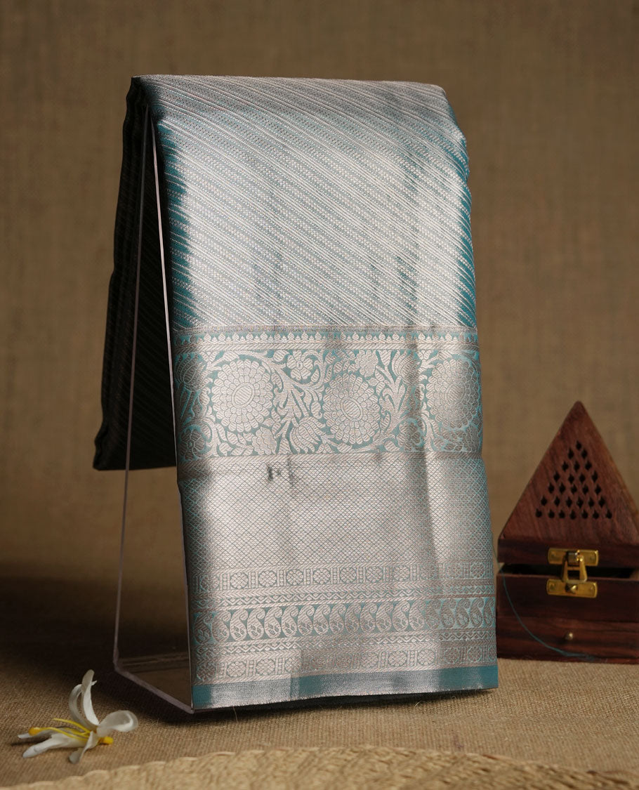 Aqua blue colour and Antique gold Zari Tissue Brocade Saree features intricate line Motifs on body and traditional border & pallu with floral patterns, paired with matching blouse