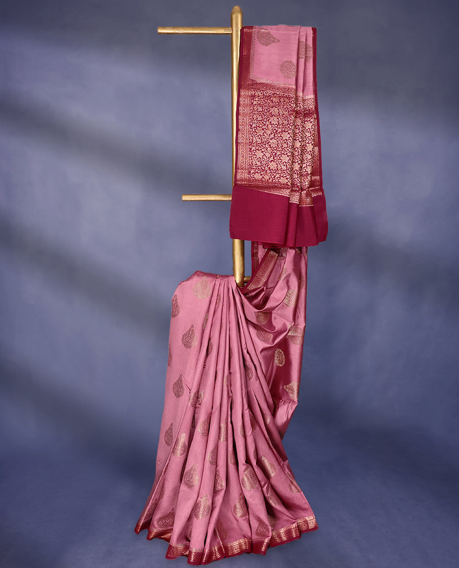 Onion Pink Colour Pure Banaras Soft Silk Saree adorned with traditional antique zari motifs, paired with a hand dyed Dark Magenta antique style border and a matching blouse.