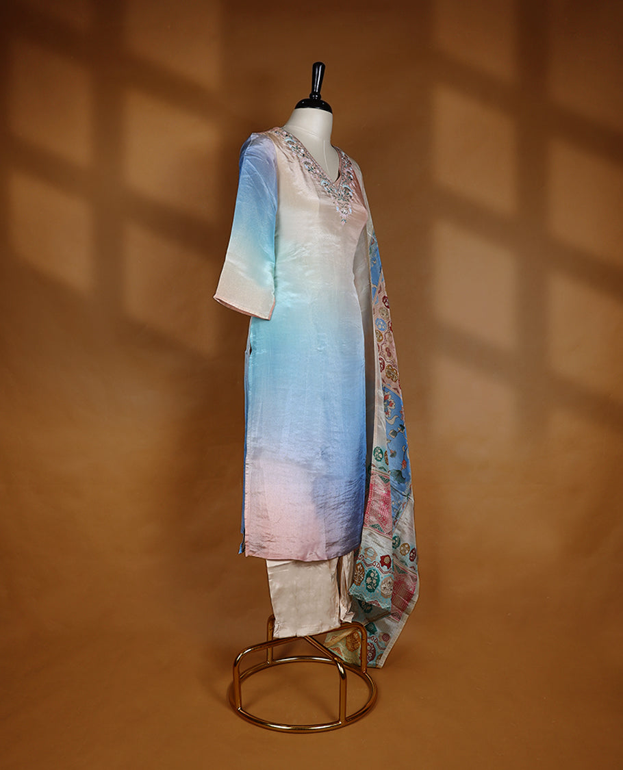 Multi shade salwar from TWARA, featuring a V-neck, adorned with cut beads, sequins, and beadwork, paired with a matching bottom and a multi colour digital printed dupatta.