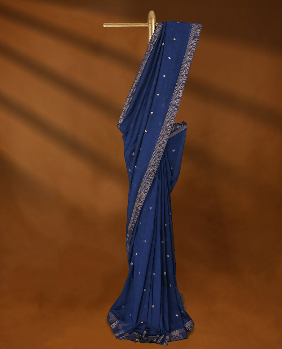 Deep Blue colour soft khadi cotton saree with Beige Zari motifs on the body, detailed woven Gold zari border, paired pallu with tussles, with matching blouse.