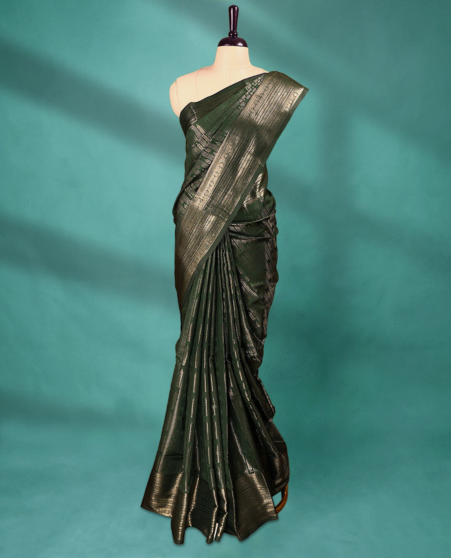 Dark Bottle Green Art Soft Silk Saree showcases intricate silver zari work on the body and border, paired with a matching blouse
