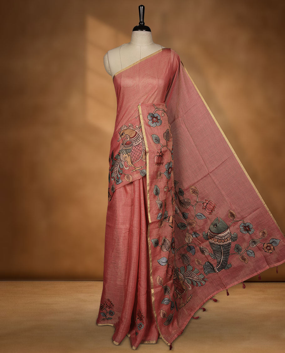 Georgia peach colour colour semi linen saree featuring hand-painted bird and floral motifs on the body, finished with a subtle gold border and paired with a matching floral print blouse.