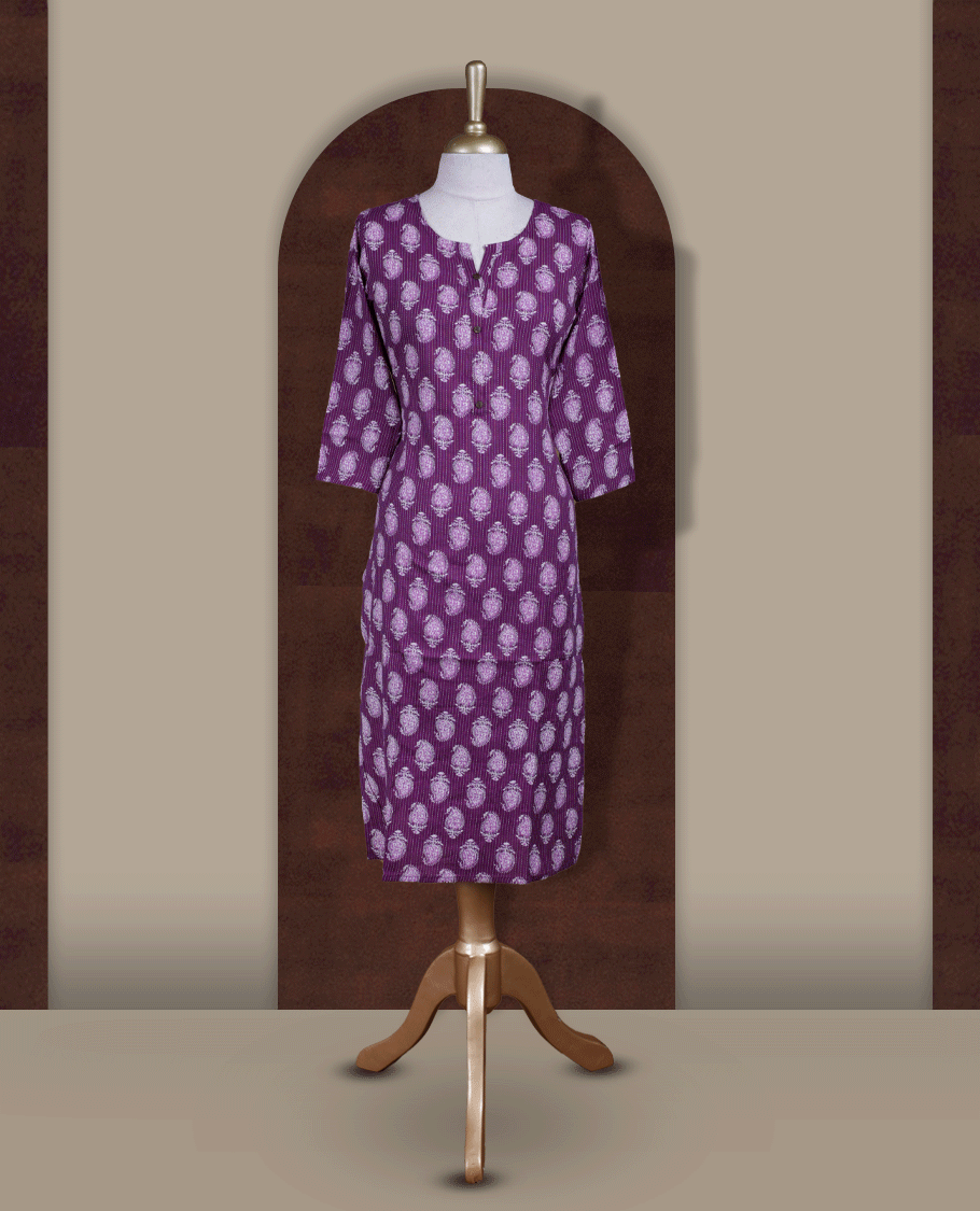 Purple colour kurthi adorned with delicate white paisley prints, featuring a stylish V notch round neckline and comfy 3/4th sleeves & Designed in a straight cut silhouette for a graceful, everyday look.