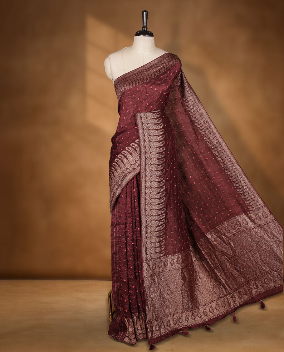 Deep Brown colour Banarasi Bandhani silk saree featuring with intricate orange colour circle motifs on body, complemented by antique zari woven border and grand pallu, paired with matching blouse