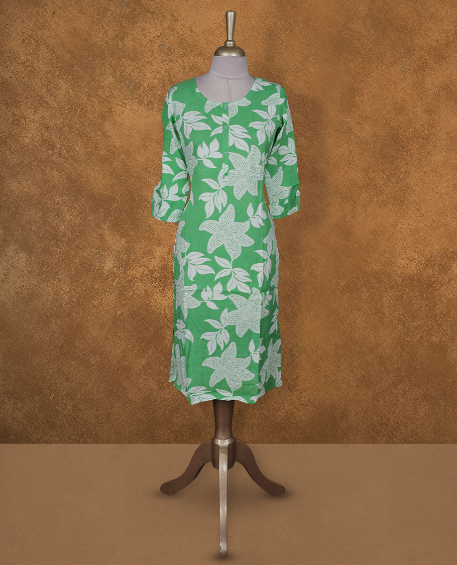 Green and white colour kurti with White floral prints, knee length design, styled with a round neckline and a sleeve .