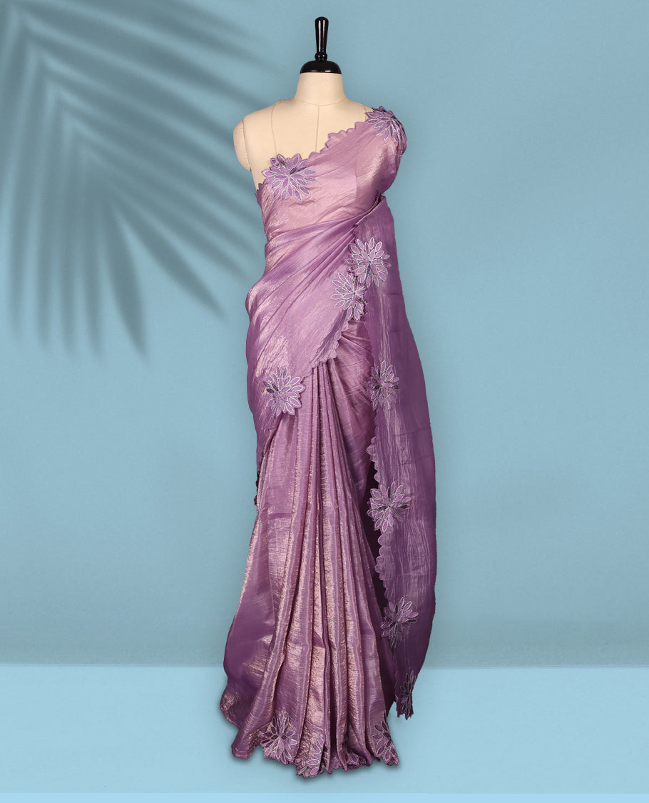 Pastel Purple colour crush soft silk saree adorned with bold floral thread embroidery on the body and scallop edged borders, Paired with a matching blouse for a complete look.
