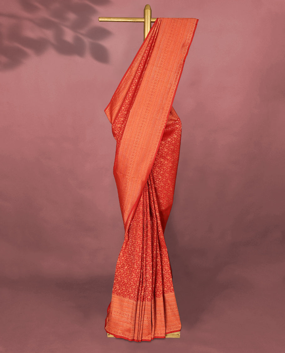 Red colour Kancheepuram saree featuring an antique zari brocade body, complemented by a traditional border and a matching blouse.
