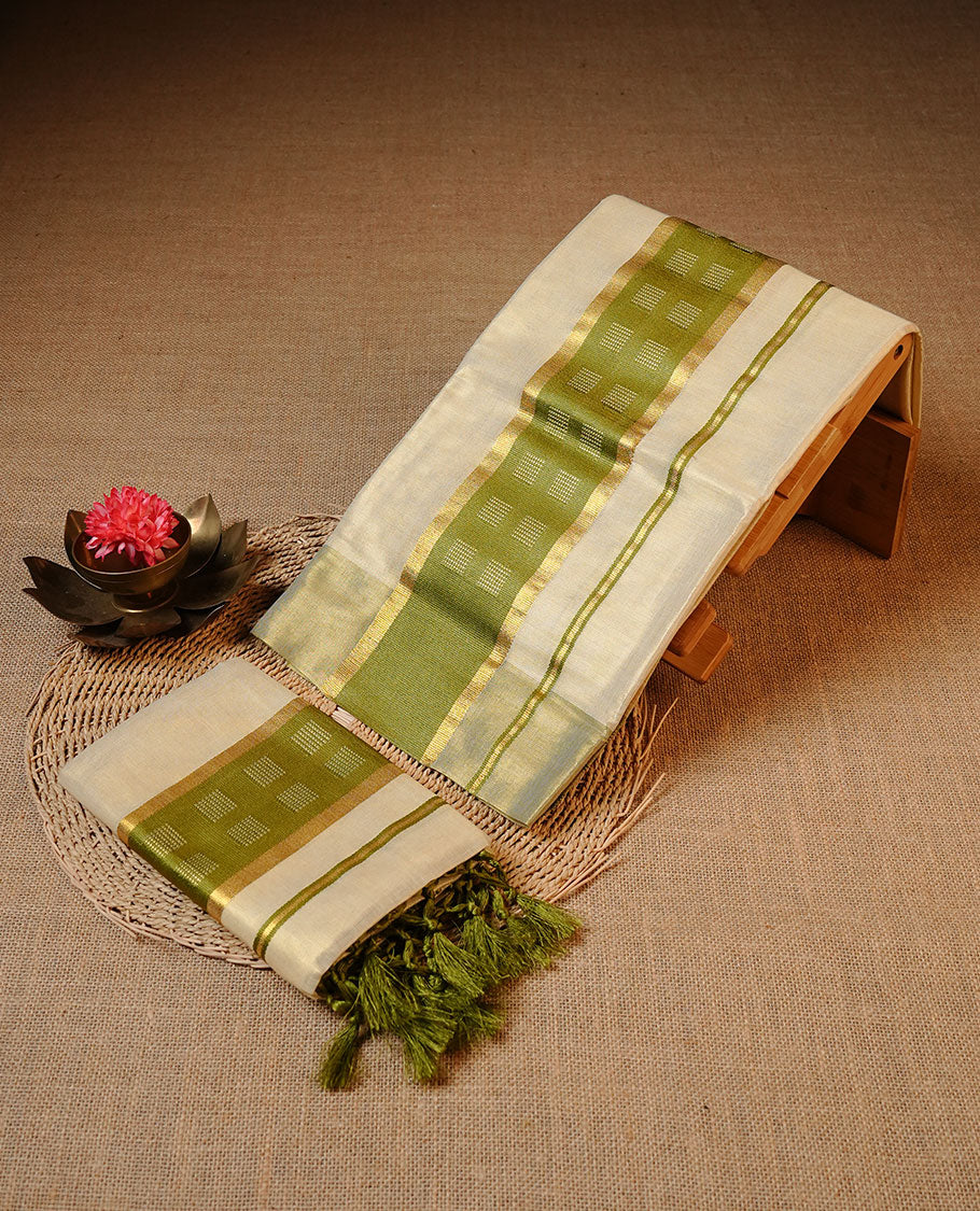 Golden colour Tissue silk set mundu features a plain body accented by a Green & gold zari border.