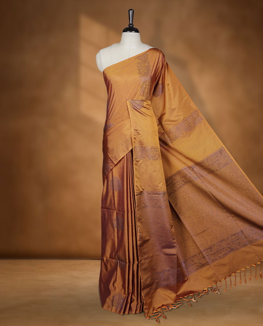 Mustard colour semi soft silk saree adorned with delicate woven floral kodi motifs on the body, complemented by a Self colour woven pallu with intricate detailing and tassel accents without border & Comes with a matching blouse piece.
