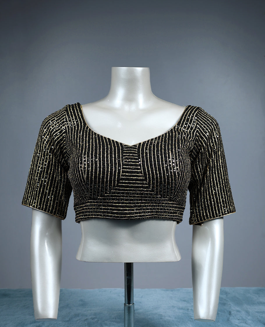 Black designer padded readymad blouse blouse with scoop neckline and elbow length sleeves, embellished with vertical and geometric lines of golden sequins perfect for party or festive wear.