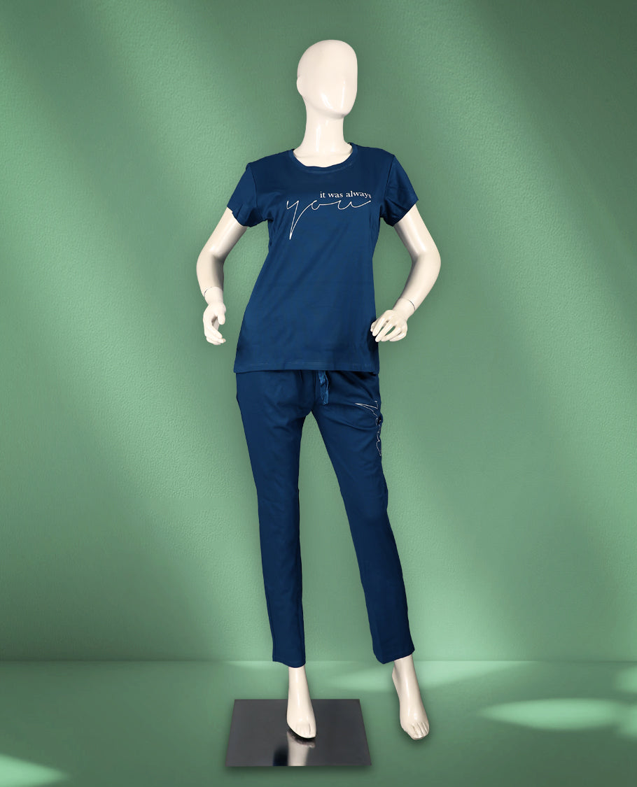 Blue colour women's nightwear set featuring a round-neck, short-sleeve top with a stylish print, paired with matching drawstring pants for a comfortable and coordinated look.