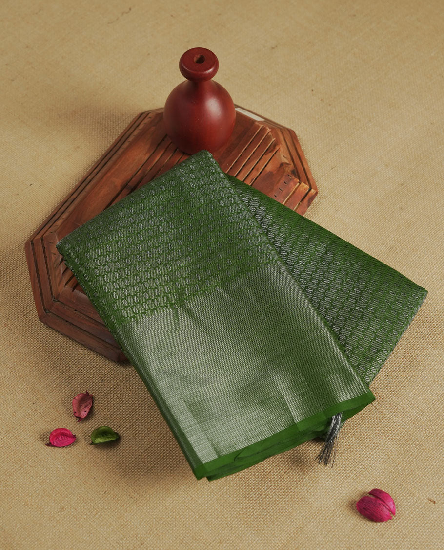 Green colour semi silk saree featuring neem zari Brocade Pattern all over the body, complemented by a Self Colour woven border with detailing,geometric pattern Pallu & plain blouse.