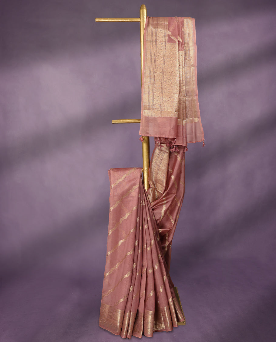 Onion Pink colour pure Banarasi Chanderi cotton, beautifully adorned with traditional antique zari Cross Kodi designs across the body, completed with a hand-dyed colour, a traditional border, and a matching blouse.