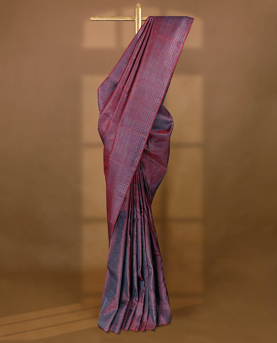 Maroon coloured Manthrakodi saree featuring a multicoloured zari jacquard body, complemented by a self coloured turning Banarasi border and a matching self coloured blouse.