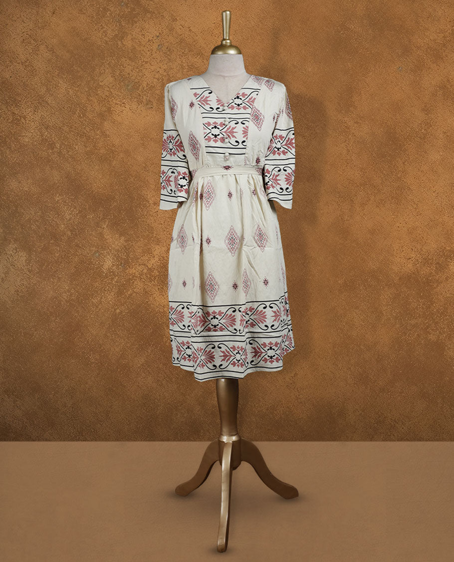 Ivory printed knee-length A-line dress with V-neckline, rose and black ethnic motifs, three-quarter sleeves, and a detachable waist belt for a cinched silhouette.