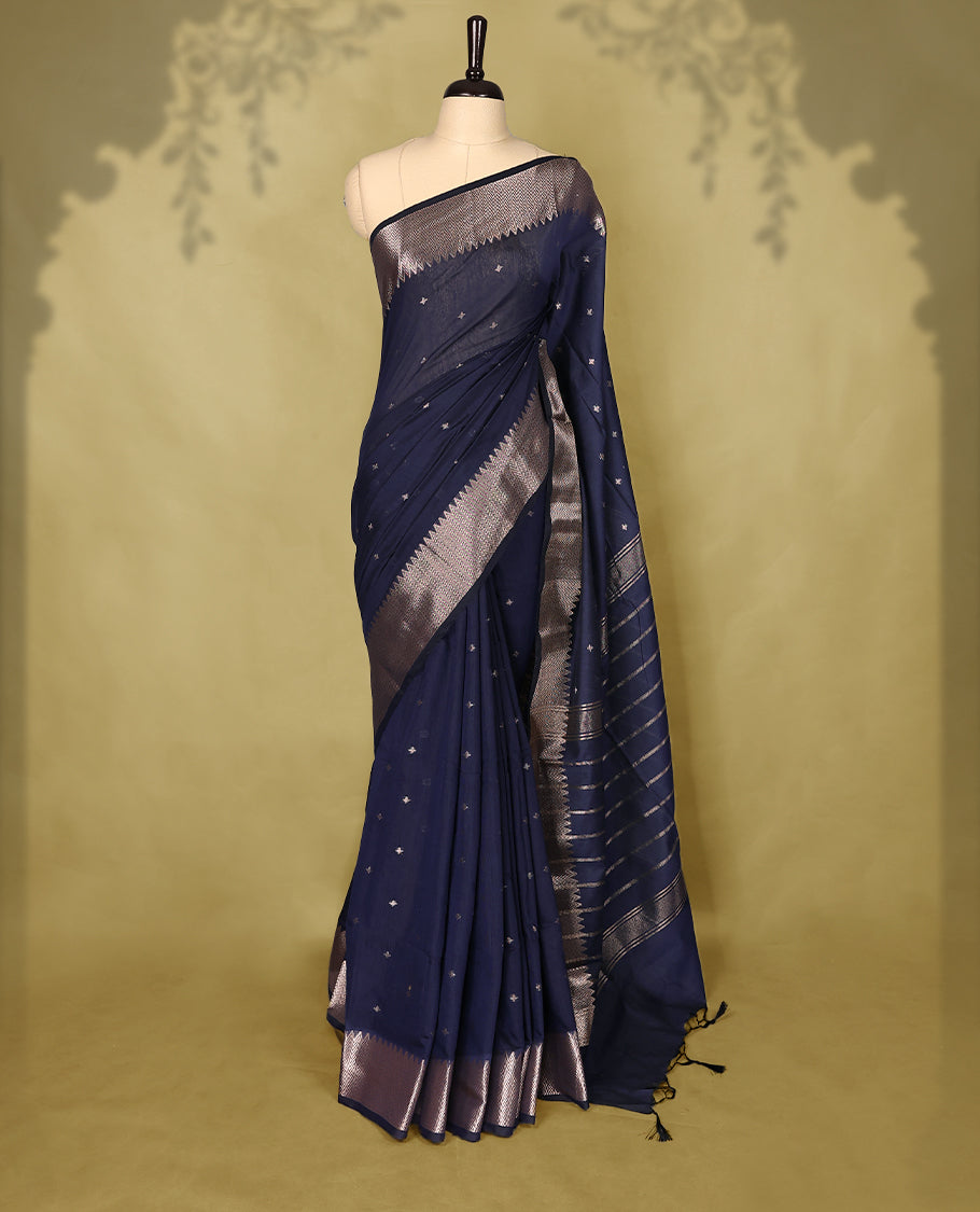 Dark Navy colour Chanderi cotton saree adorned with delicate Golden Flower motifs on the body, paired with a traditional Mangalagiri style golden zari border with matching blouse.