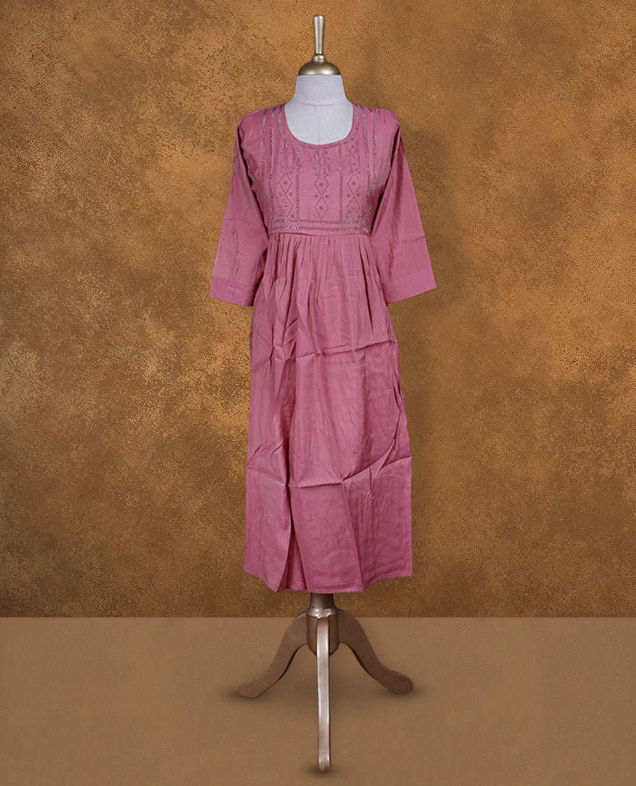 Pastel pink colour kurti with white stone pattern, knee length design, styled with a Round neckline and a sleeve .