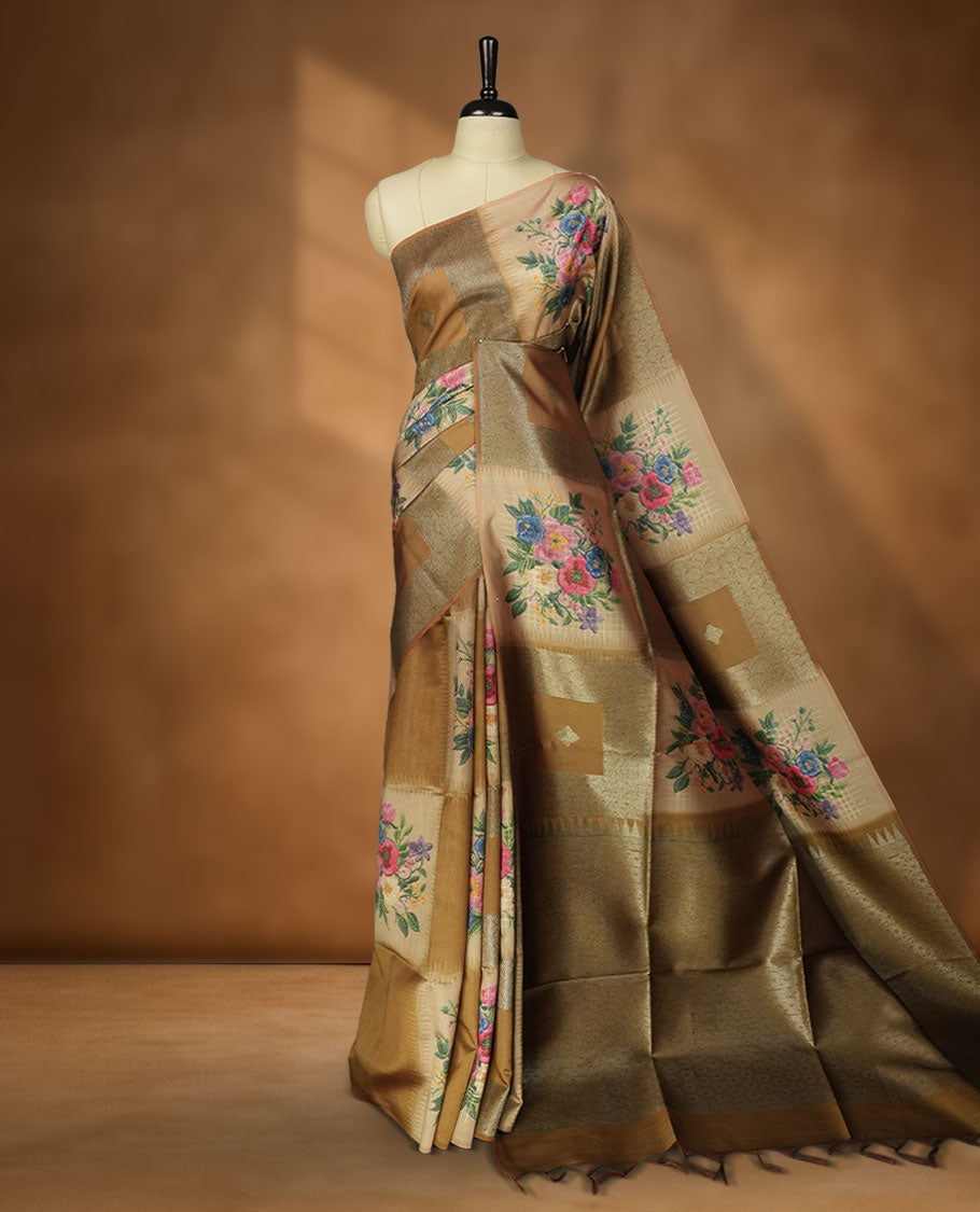 Dark Yellow color semi tussar Banarasi saree featuring vibrant multi-color floral prints across the body, with geometric zari patterns, and a matching blouse detailed with silver woven buttas.