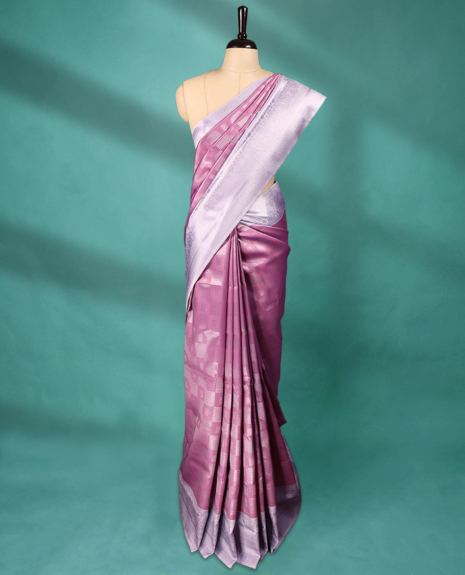 Pastel Pink coloured semi silk saree featuring a Zari design on the body, paired with a Baby Blue coloured border and matching blouse.