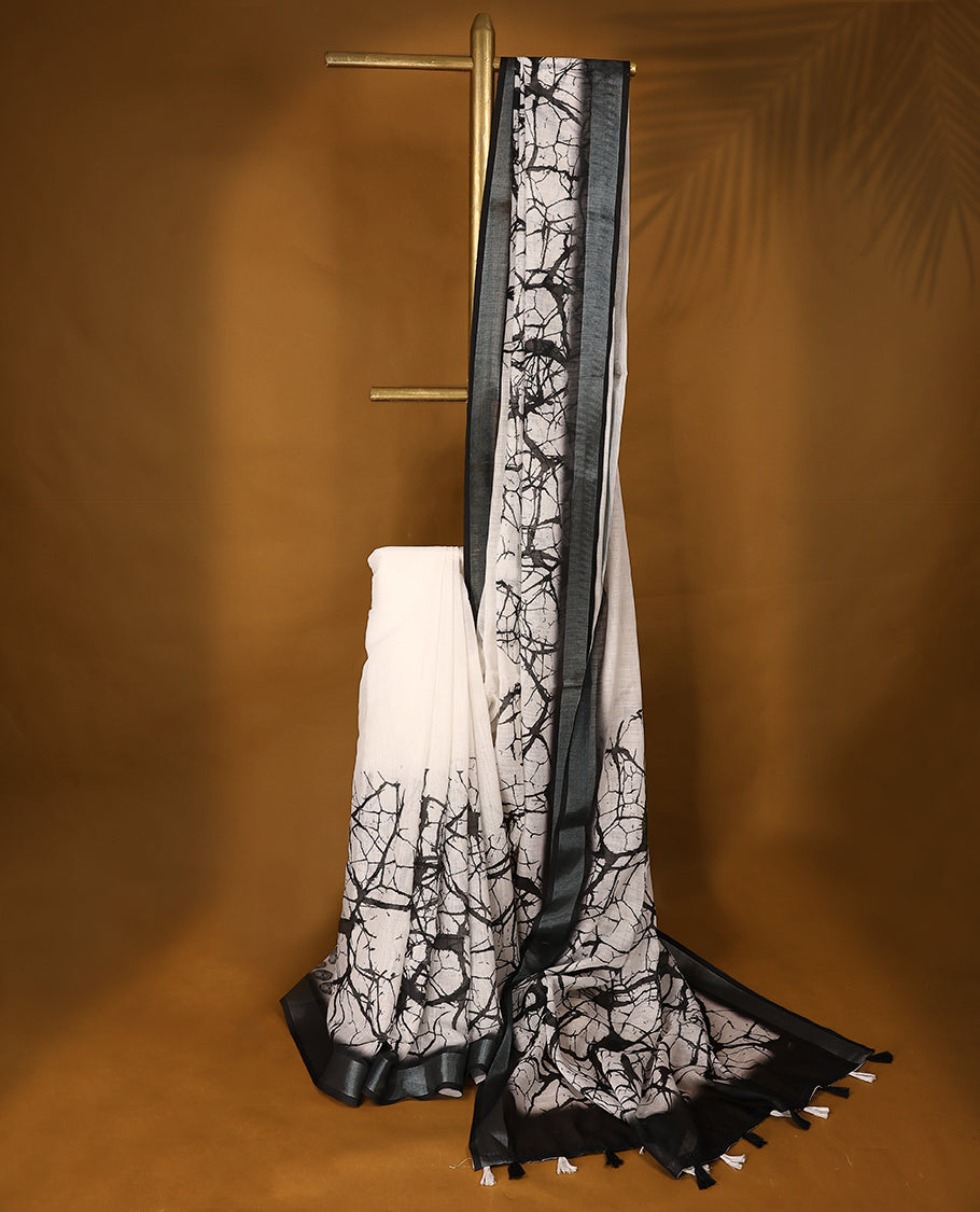 Black and white cotton saree featuring a nature-inspired abstract print and a sleek black border with Matching Blouse