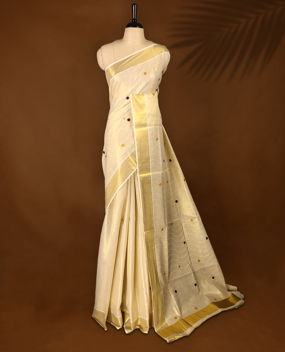 Light Gold colour Tissue Kerala saree featuring Thread work on the body and a beautifully woven Gold Kasavu border, paired with a matching blouse perfect for festive occasions.