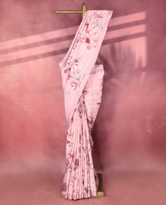 Rose pink colour pure linen saree featuring elegant floral digital prints across the body with subtle woven stripes adding a soft texture, complemented by a simple solid border pairs beautifully with a matching blouse.