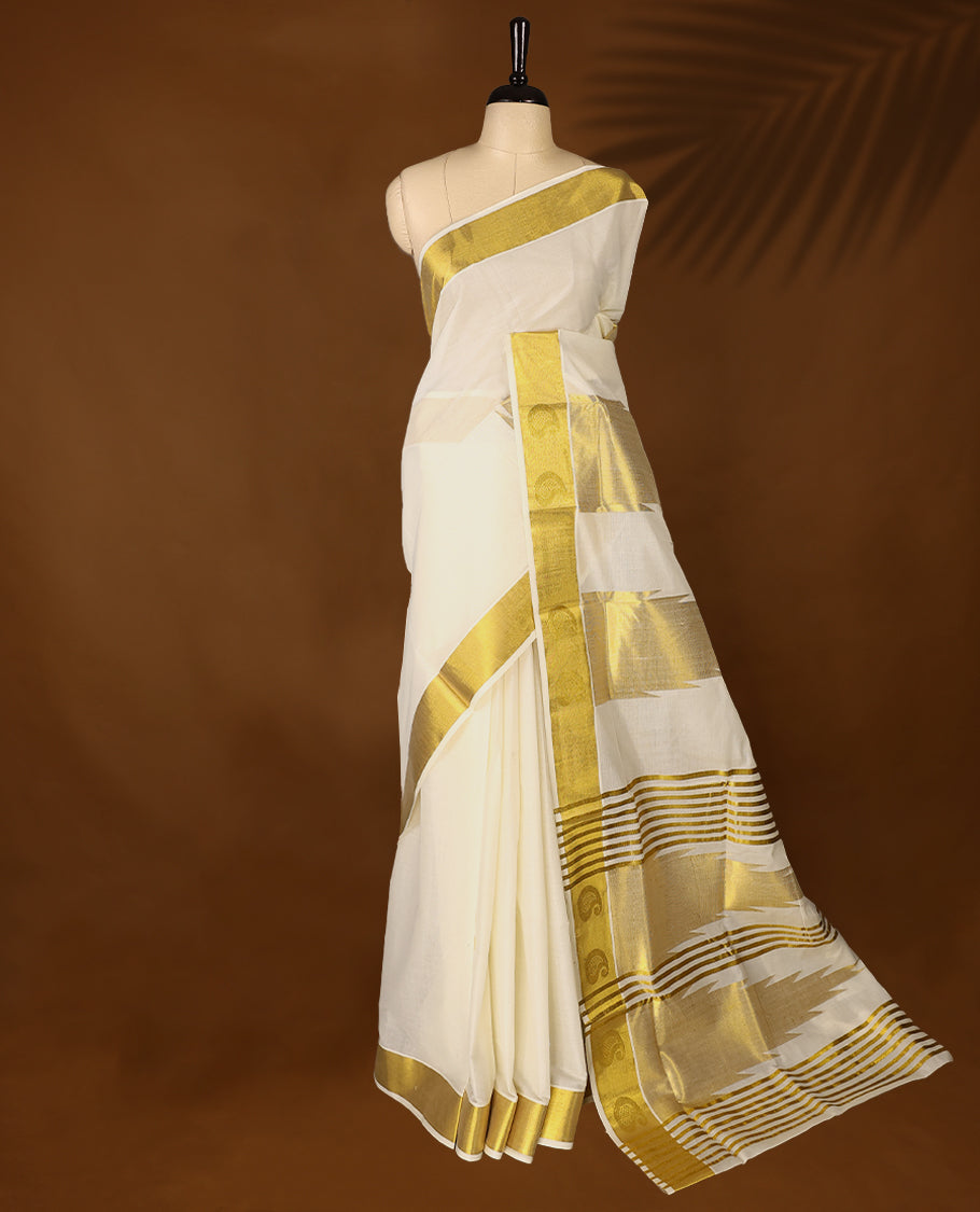 Elegant off white colour cotton Kerala saree featuring Plain body, Gold Kasavu border with Mango Motifs, rich pallu with temple motifs, Paired with matching blouse offering a classic and graceful look, paired with a matching blouse.