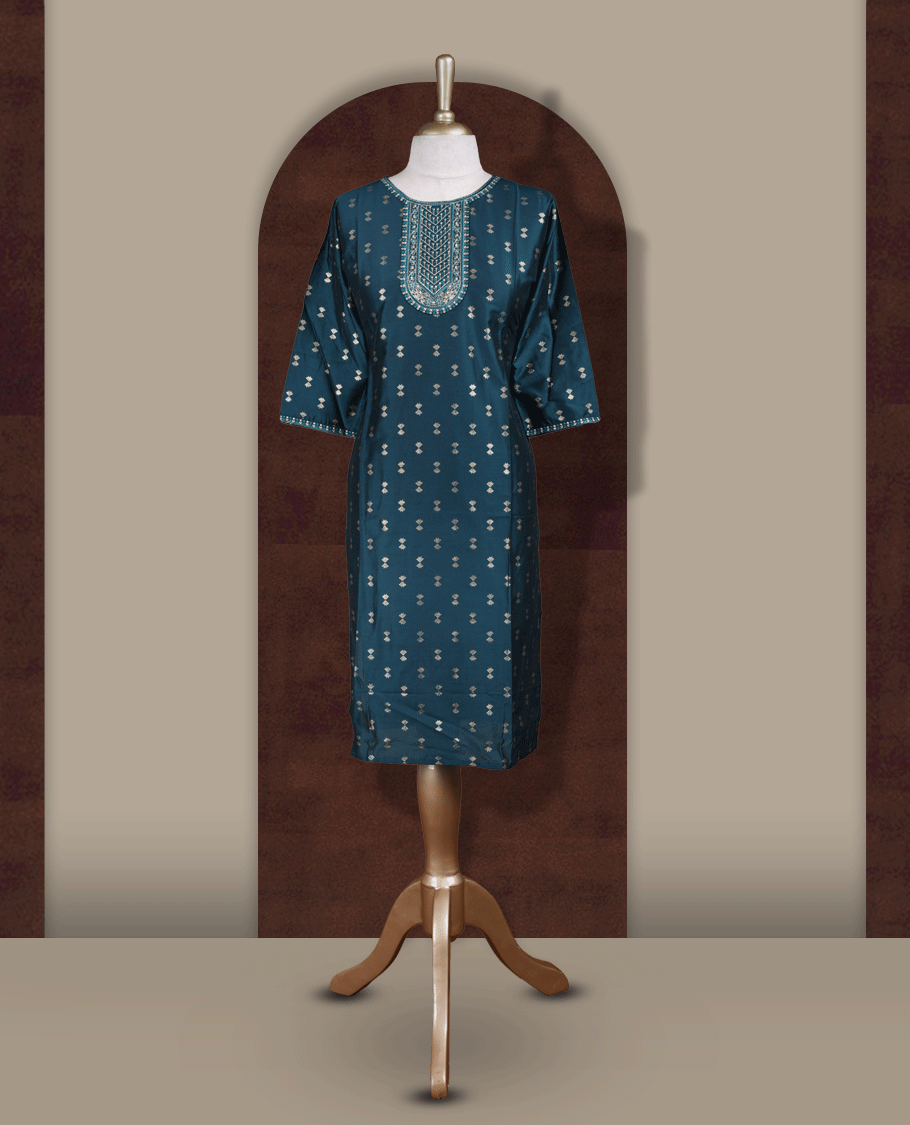 Dark peacock green colour kurti from TWARA, featuring intricate golden foil prints all over and elegant embroidery on the neckline, finished with a round neck and elbow length sleeves.