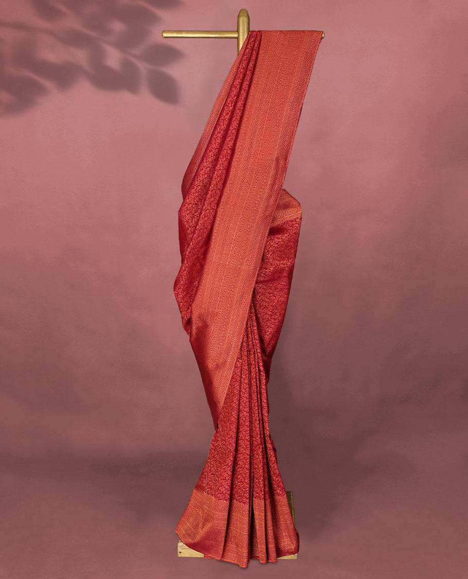 Dark Red colour Kancheepuram saree featuring an antique zari brocade body, complemented by a traditional border and a matching blouse.