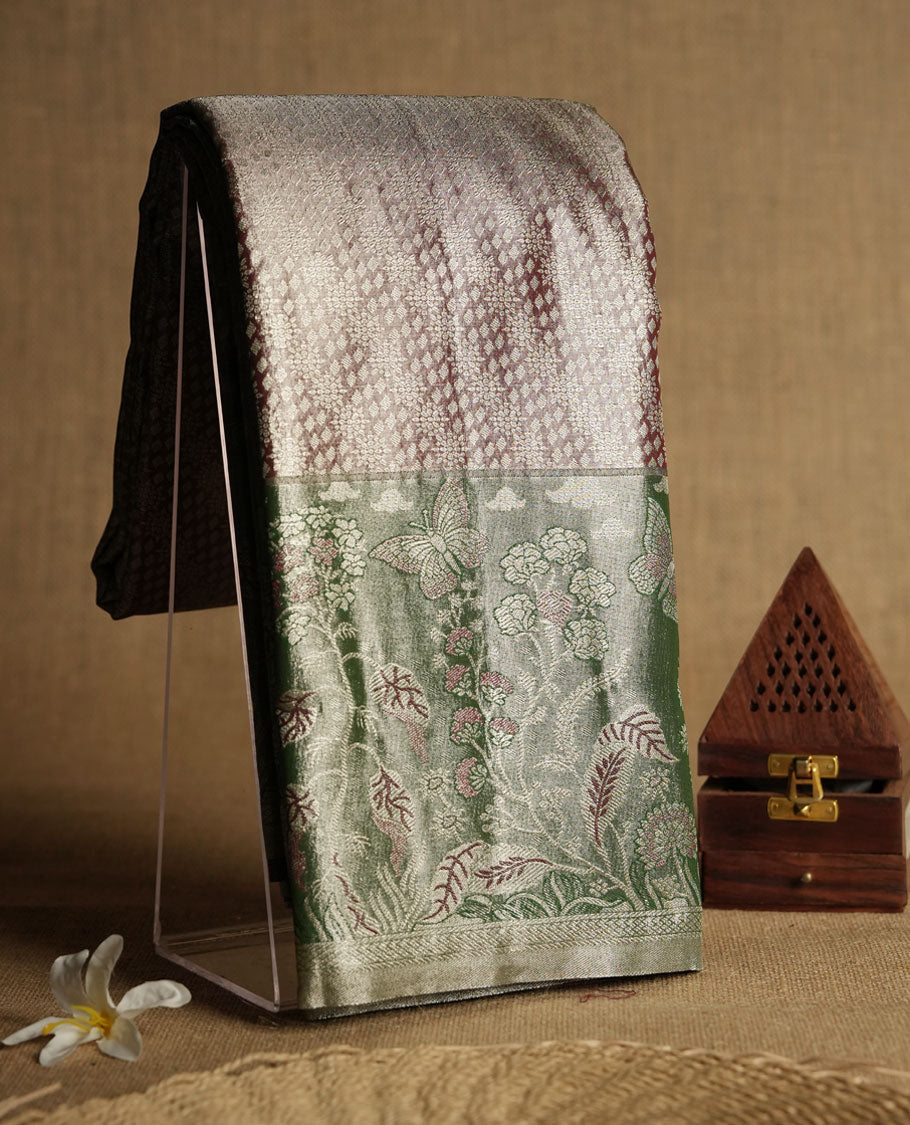 brick red colour and Antique gold Zari Tissue Brocade Saree features intricate Motifs on body and a dark green colour with fancy border & pallu with floral patterns, paired with matching blouse