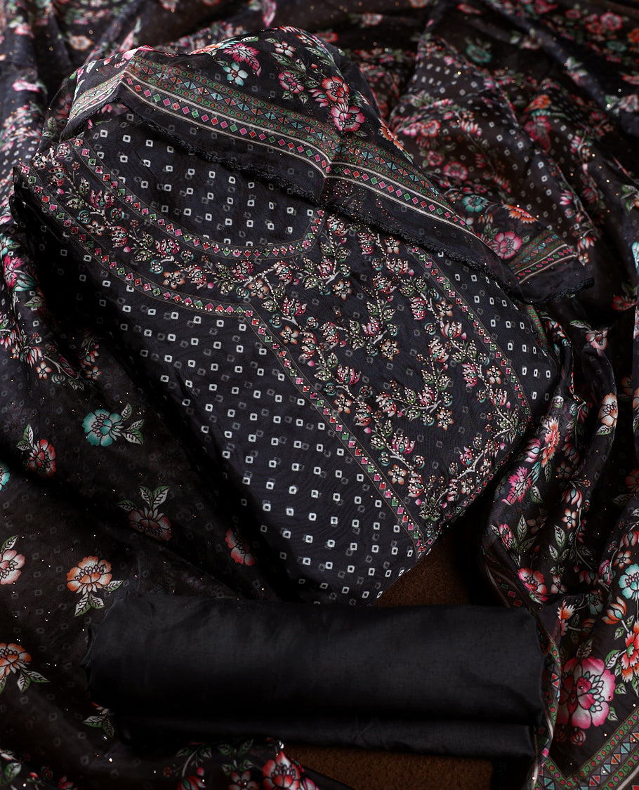 Chic black churidhar material adorned with delicate floral, stone and vine motifs, paired with a vibrant printed dupatta and plain matching bottom, offering a perfect blend of elegance and festive charm.