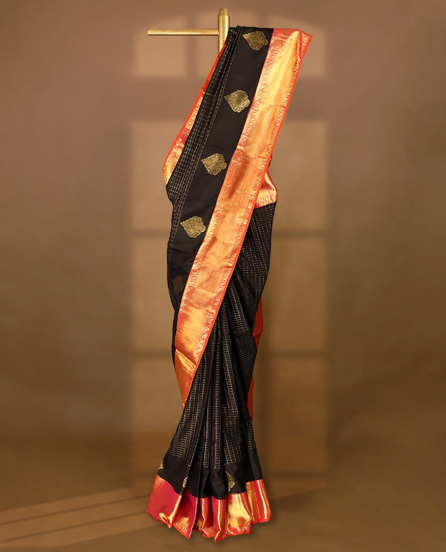 Black Colour pure traditional Kancheepuram silk saree featuring antique zari check designs on the body, complemented by a traditional contrast coloured border and a matching contrast blouse.