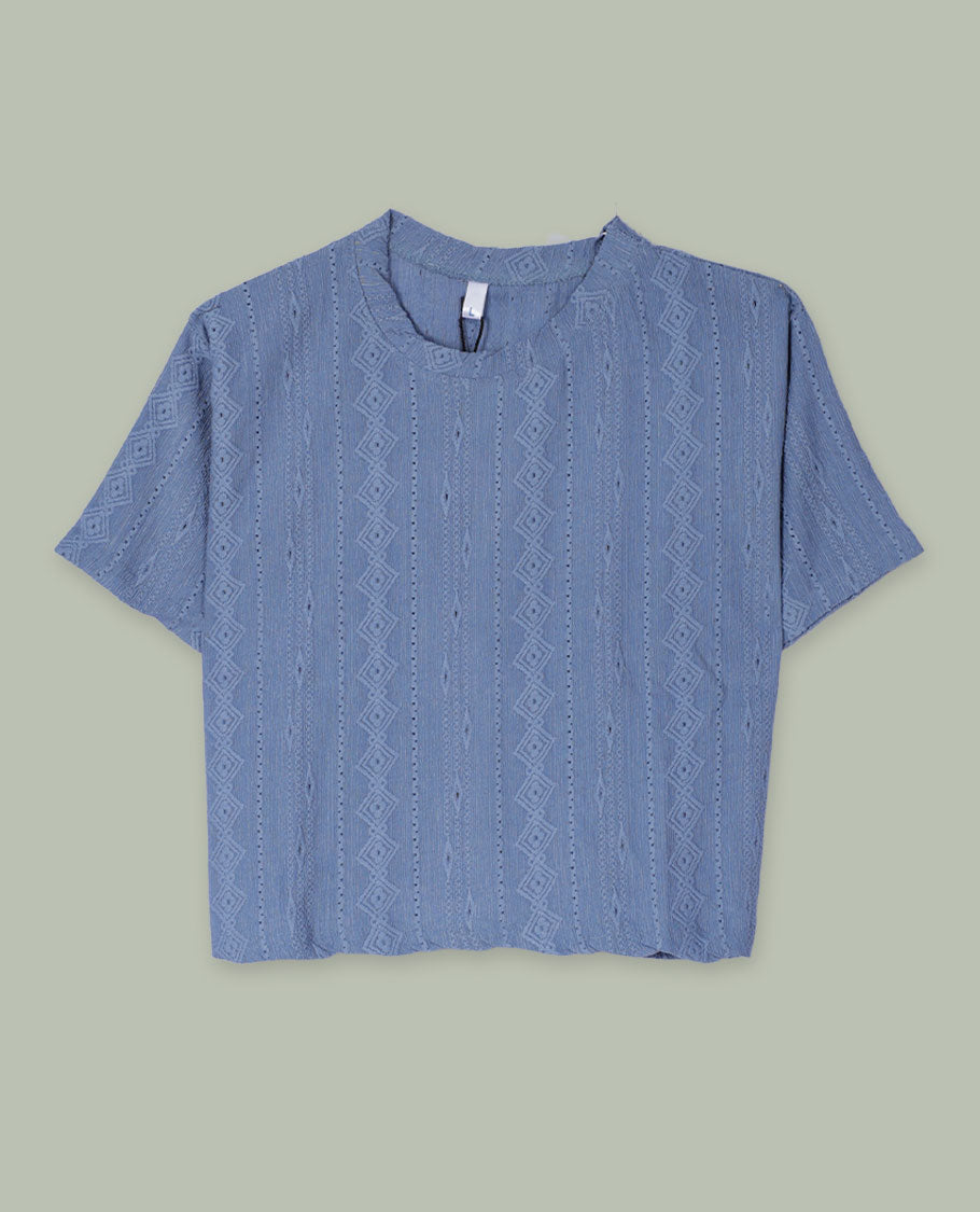 Dusty blue textured short-sleeve top with round neckline and subtle vertical geometric jacquard pattern all over.