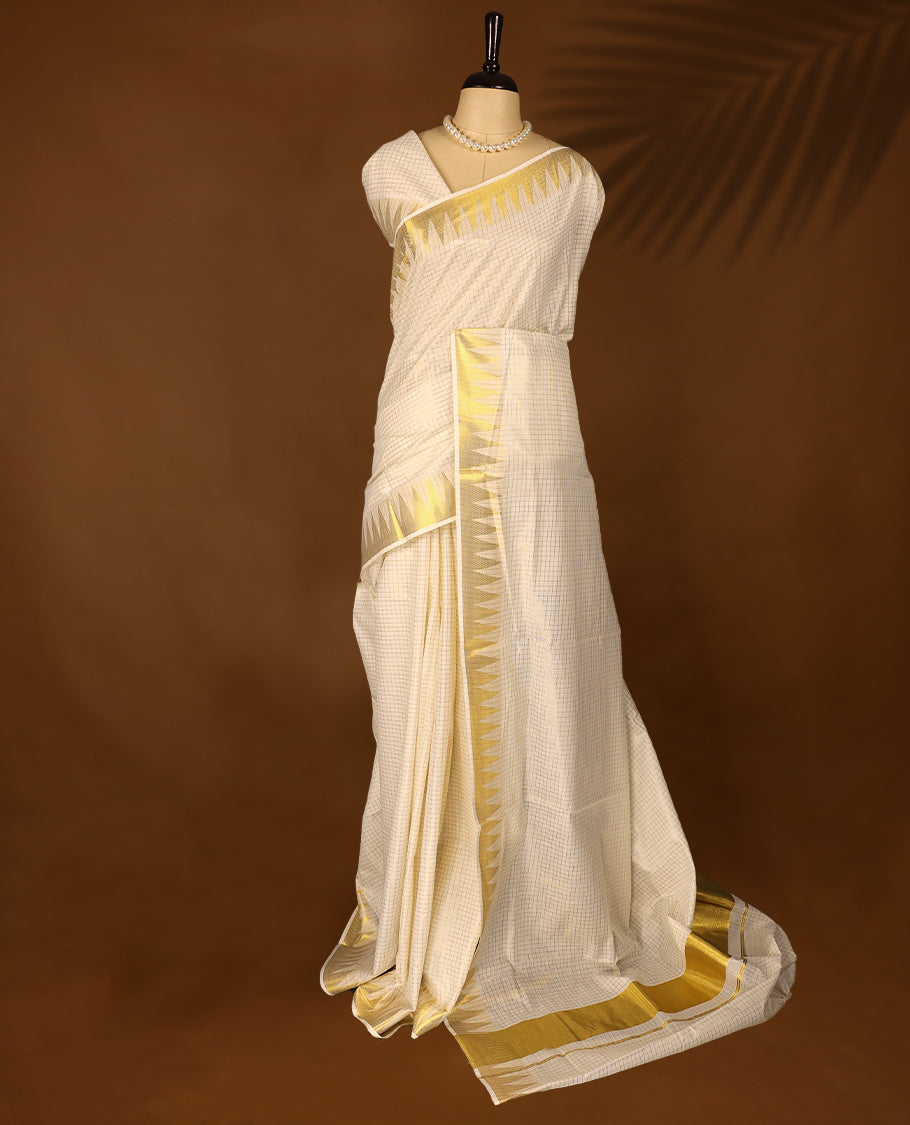 Kerala cotton saree with fine golden Checks and a 3 inch Golden lustrous zari border with Matching Blouse
