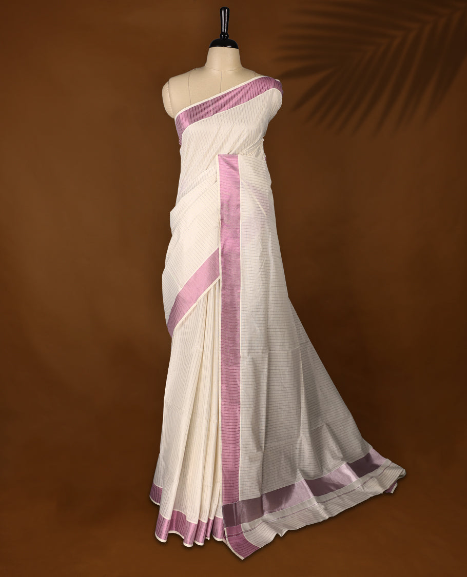 Elegant off white colour cotton Kerala saree featuring a RoseGold stripes on body, with Rosegold Colour kasavu border offering a classic and graceful look, paired with a matching blouse.