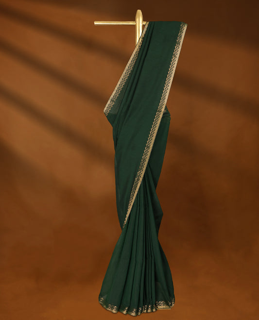 Bottle Green colour soft khadi cotton saree with plain body, detailed woven Gold zari border, paired pallu with tussles, with matching blouse.