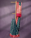 German Blue colour pure Banarasi Chanderi cotton fabric, featuring traditional antique zari buttas on the body, complemented by a traditional Rani Pink Colour border and a matching blouse.