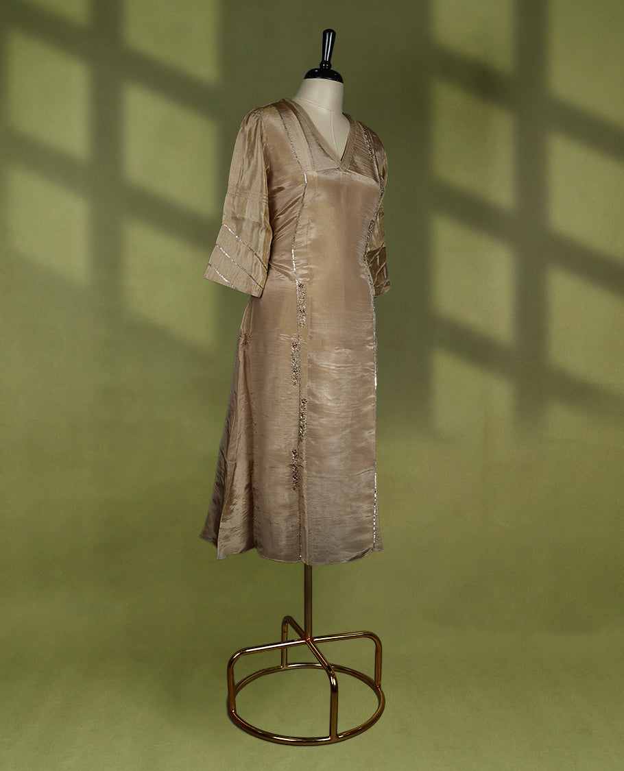 Dark beige coloured stylish kurthi without slit, featuring a V neck design adorned with intricate cut bead, sequin, and thread work, for women