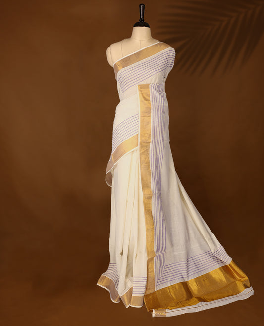 Elegant off white colour cotton Kerala saree featuring lavender colour Thread detailing on body, gold zari traditional kasavu border, Paired with matching blouse offering a classic and graceful look