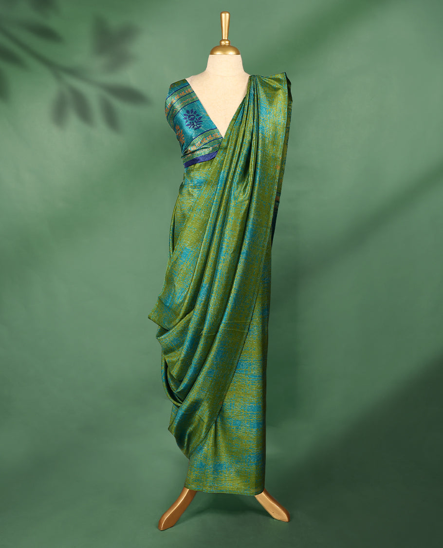 Olive green colour Manipuri saree with subtle blue textured patterns, minimal border, and comes with a matching blouse.