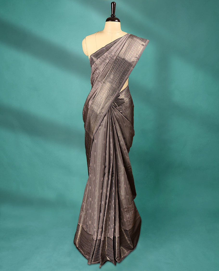 Metallic Beige Art Soft Silk Saree showcases intricate silver zari work on the body and border, paired with a matching blouse