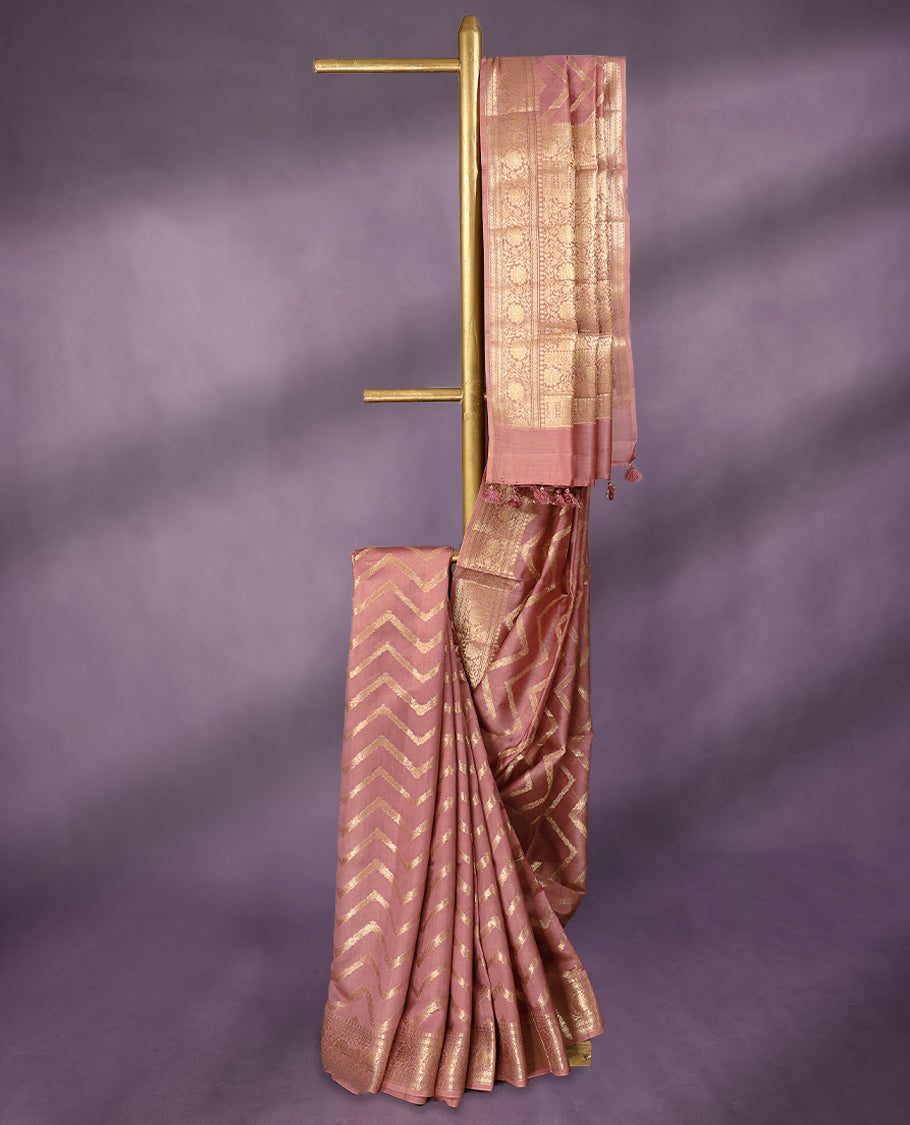 Onion Pink colour pure Banarasi Chanderi cotton, beautifully adorned with traditional antique zig zag Kodi designs across the body, completed with a hand-dyed colour, a traditional border, and a matching blouse.